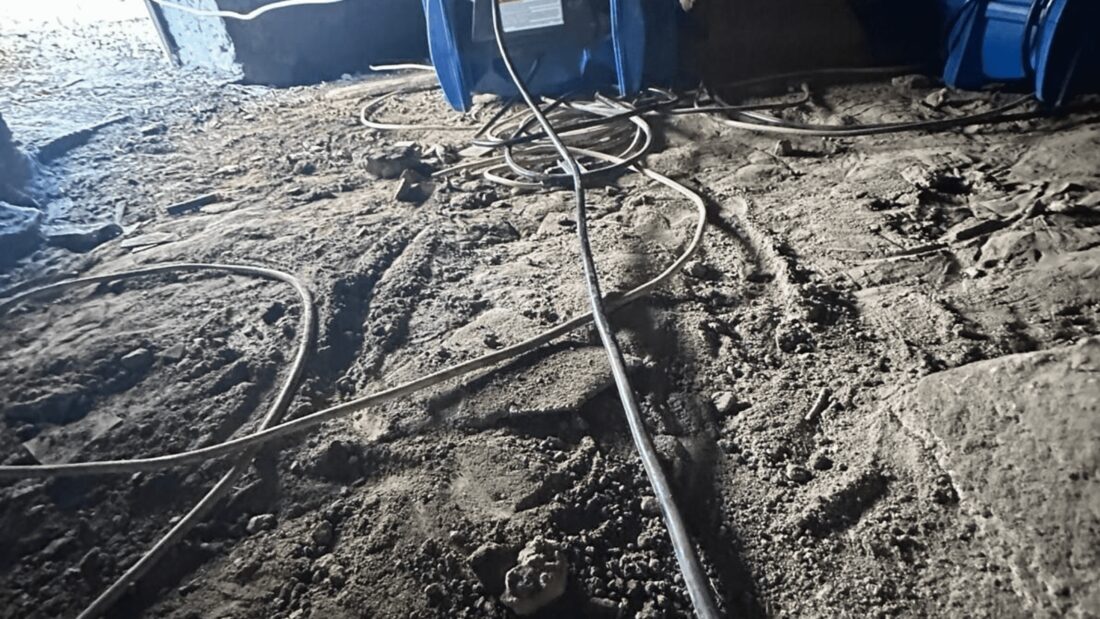 Drying equipment staged in a crawl space